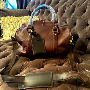 Brand New never used brown leather overnite bag.